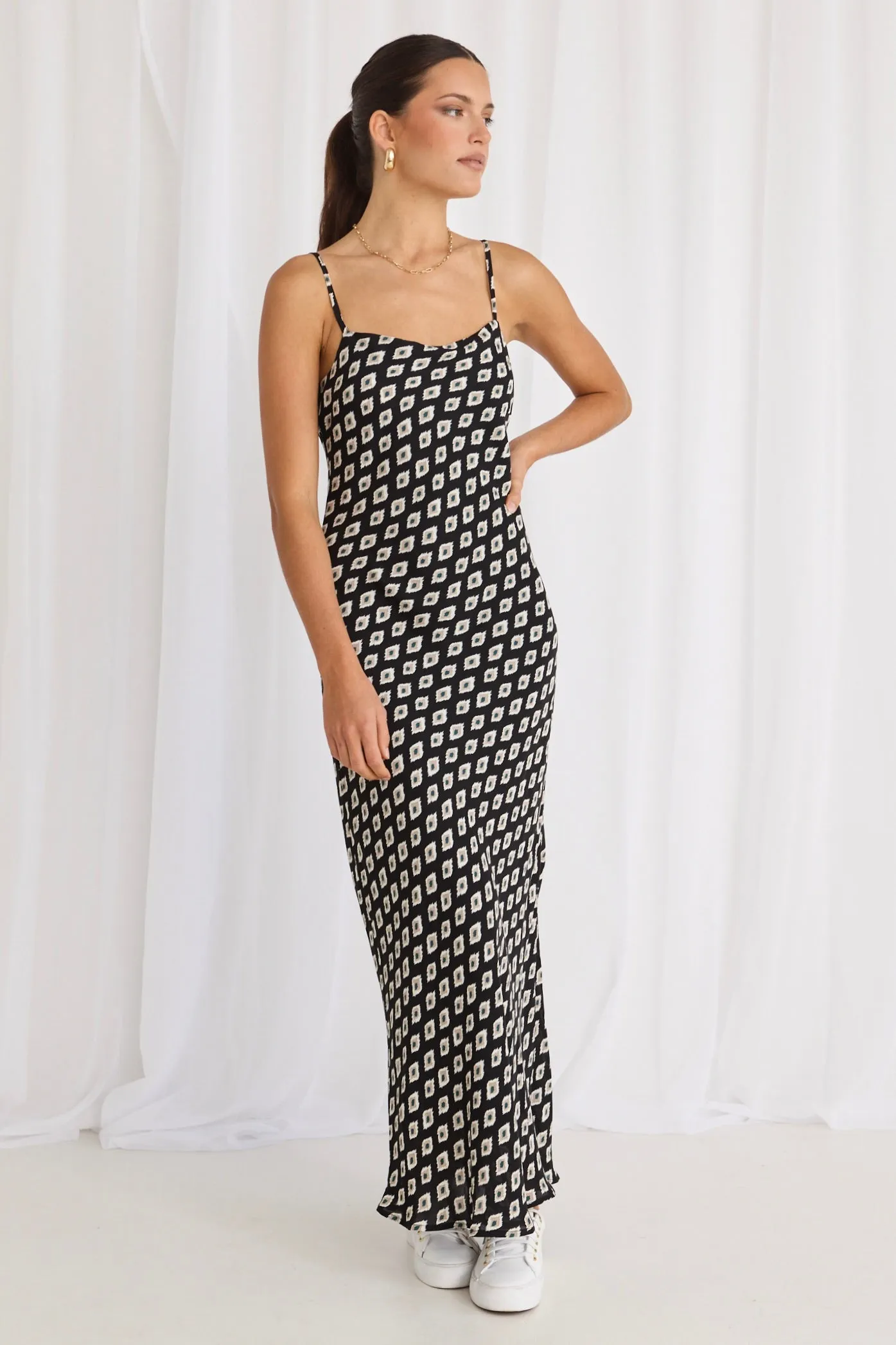 Sure! Heres an optimized title with modifiers for the product:

Elegant Camero Geo Print Strappy Maxi Dress with Bias Cut

This title includes descriptive words that enhance the appeal of the product, such as Elegant and Geo Print, while also making sure to keep relevant keywords like Strappy Maxi Dress and Bias Cut.