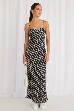 Sure! Heres an optimized title with modifiers for the product:

Elegant Camero Geo Print Strappy Maxi Dress with Bias Cut

This title includes descriptive words that enhance the appeal of the product, such as Elegant and Geo Print, while also making sure to keep relevant keywords like Strappy Maxi Dress and Bias Cut.