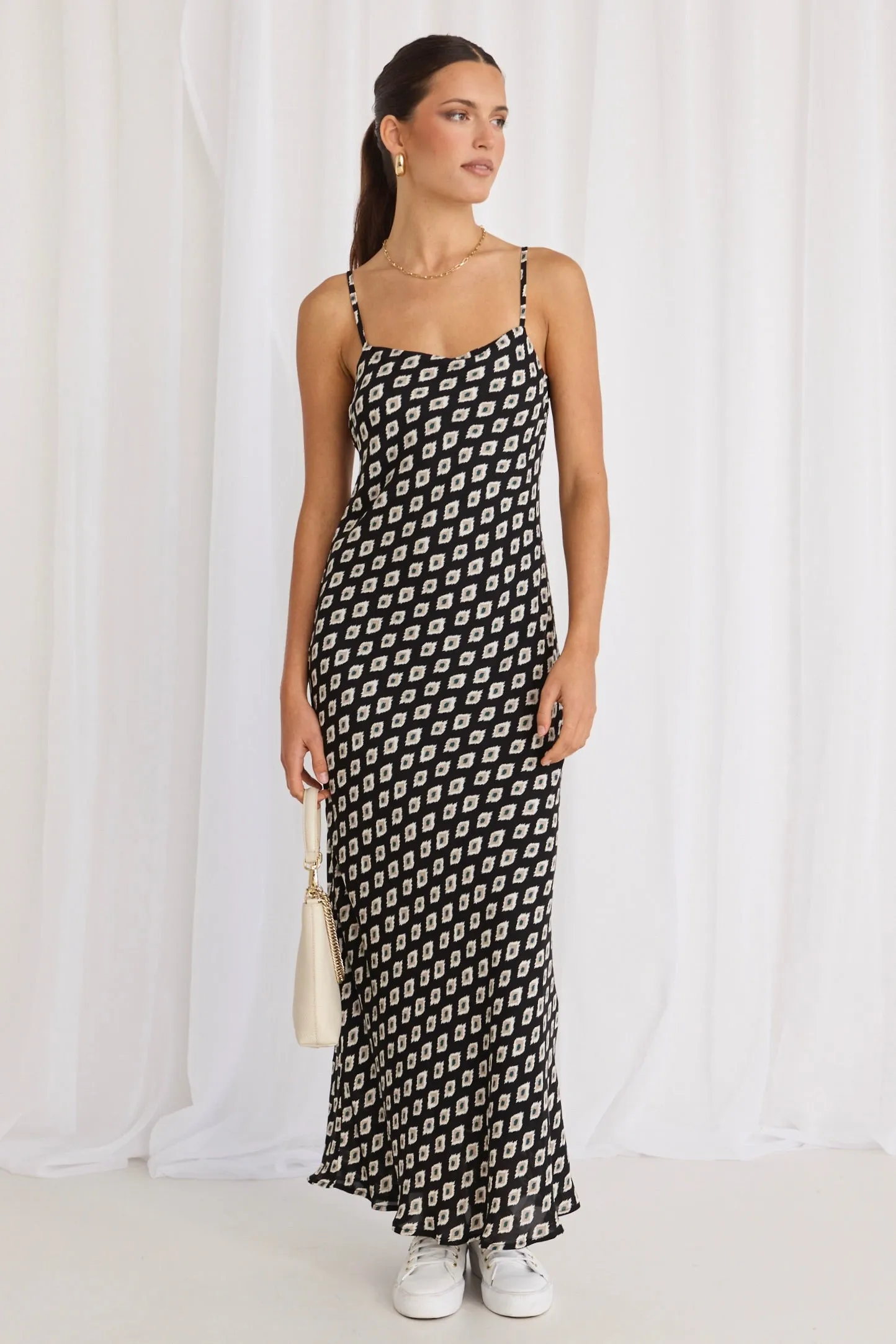 Sure! Heres an optimized title with modifiers for the product:

Elegant Camero Geo Print Strappy Maxi Dress with Bias Cut

This title includes descriptive words that enhance the appeal of the product, such as Elegant and Geo Print, while also making sure to keep relevant keywords like Strappy Maxi Dress and Bias Cut.